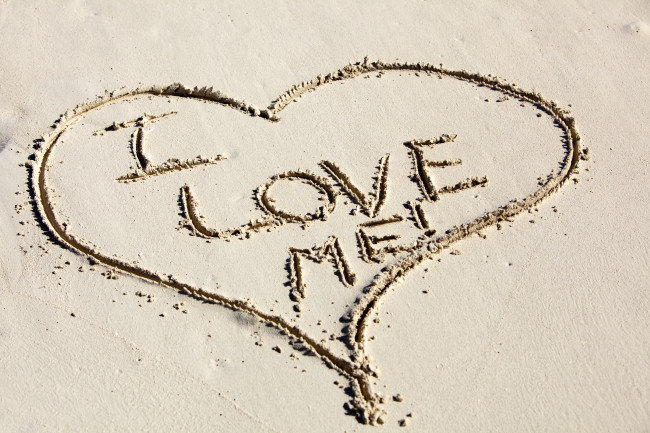 I Love Me Written inside a Heart Drawn in Sand